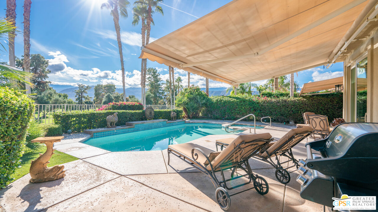 72 North Kavenish Drive Rancho Mirage, CA 92270 - Photo 56 of 73 a view of patio with table and chairs under an umbrella