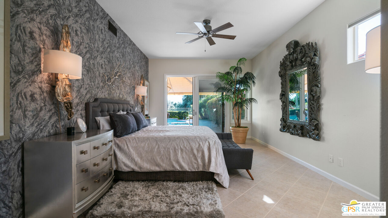 72 North Kavenish Drive Rancho Mirage, CA 92270 - Photo 6 of 73 a spacious bedroom with a bed and a window