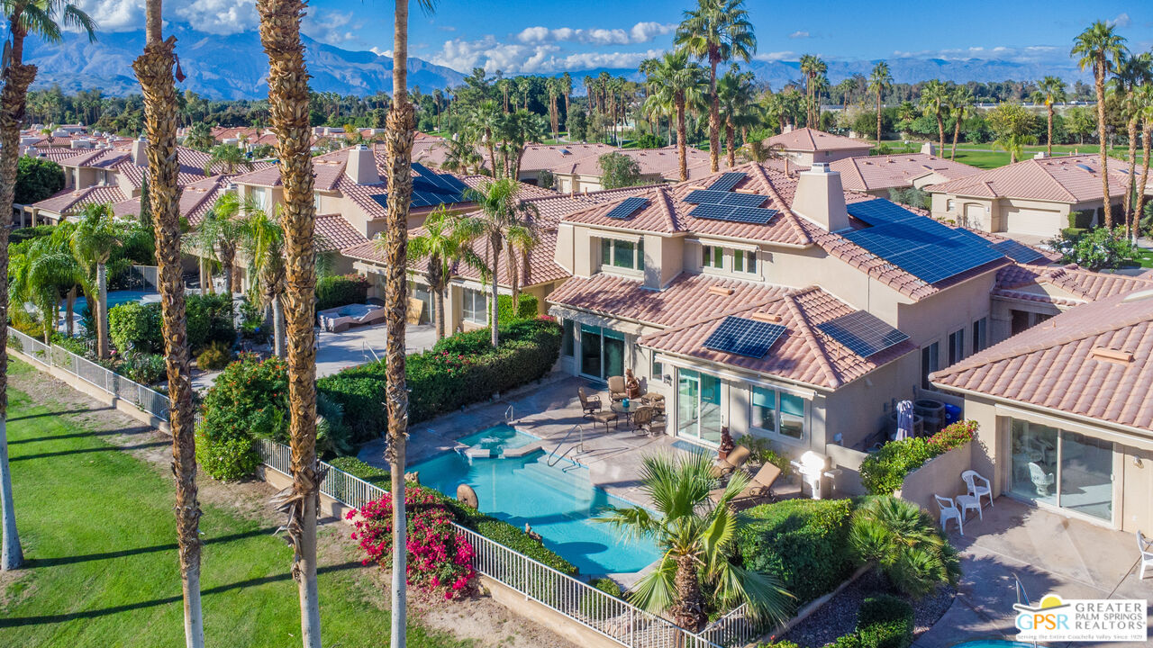 72 North Kavenish Drive Rancho Mirage, CA 92270 - Photo 61 of 73 an aerial view of multiple houses with a yard