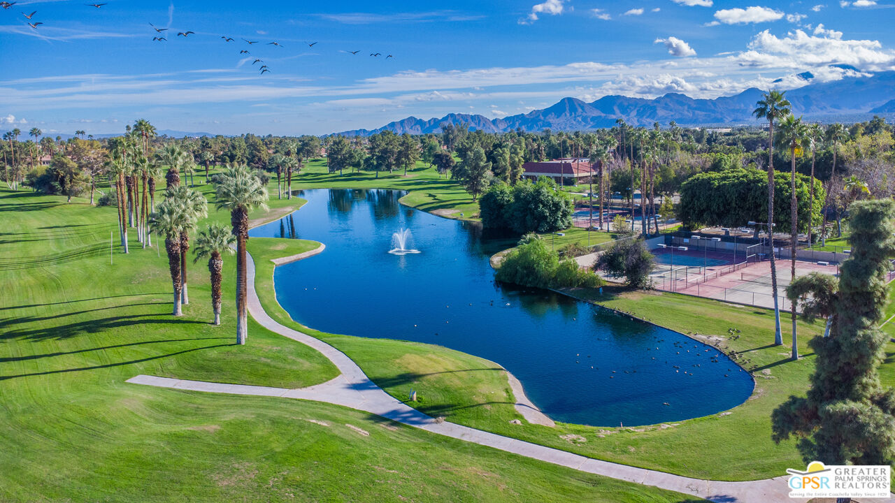 72 North Kavenish Drive Rancho Mirage, CA 92270 - Photo 68 of 73 a view of a lake with a mountain in the background