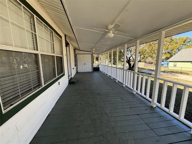 a view of a kitchen with wooden floor and a sink