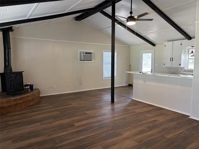 a kitchen with sink and mirror