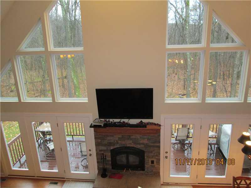 796 Camp Run Road Donegal, PA 15628 - Photo 3 of 16 Great Room. FLOOR TO CEILING WINDOWS AND DOORS.WARM AND COZY WOODBURNER.WALK OUT TO TREX DECK GREAT FOR ENTERTAINING.