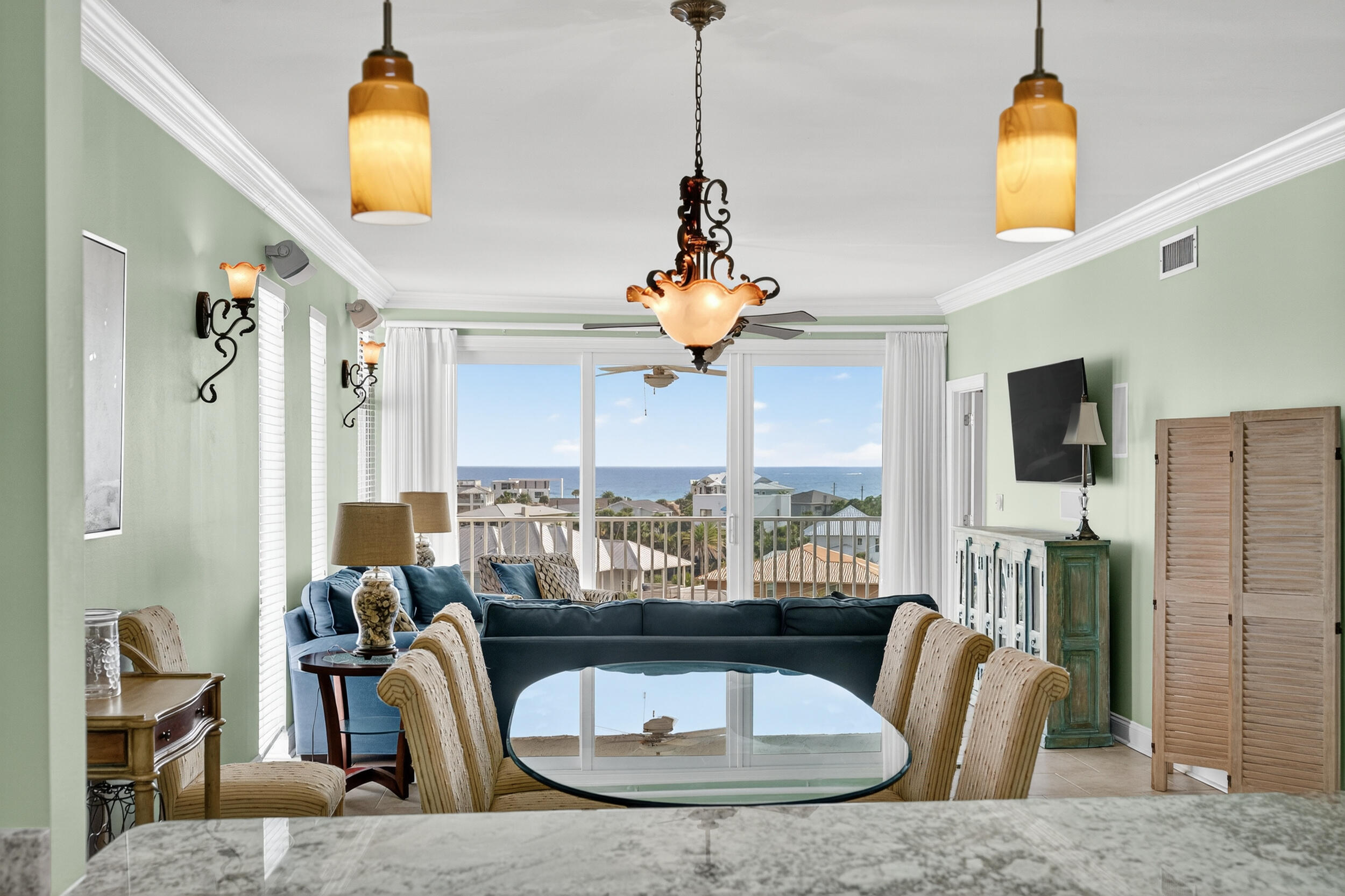 30 Moreno Point Road, Unit 702A Destin, FL 32541 - Photo 12 of 51 a living room with fireplace furniture and a chandelier