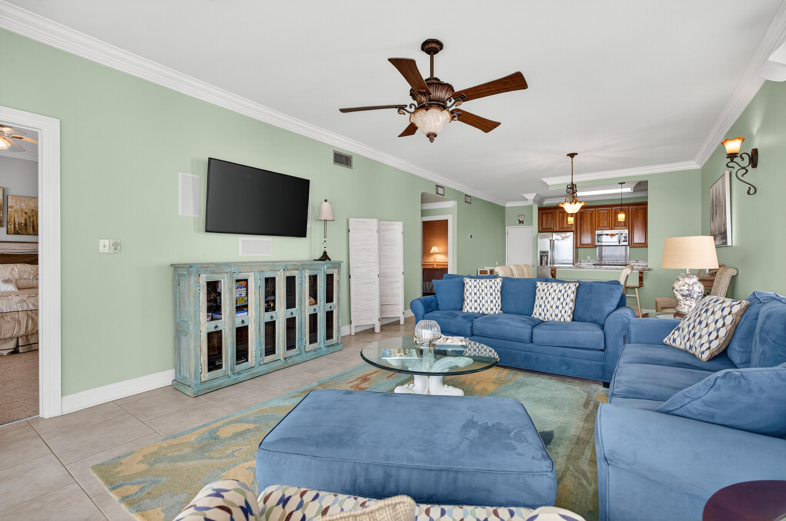 30 Moreno Point Road, Unit 702A Destin, FL 32541 - Photo 20 of 51 a living room with furniture and a flat screen tv