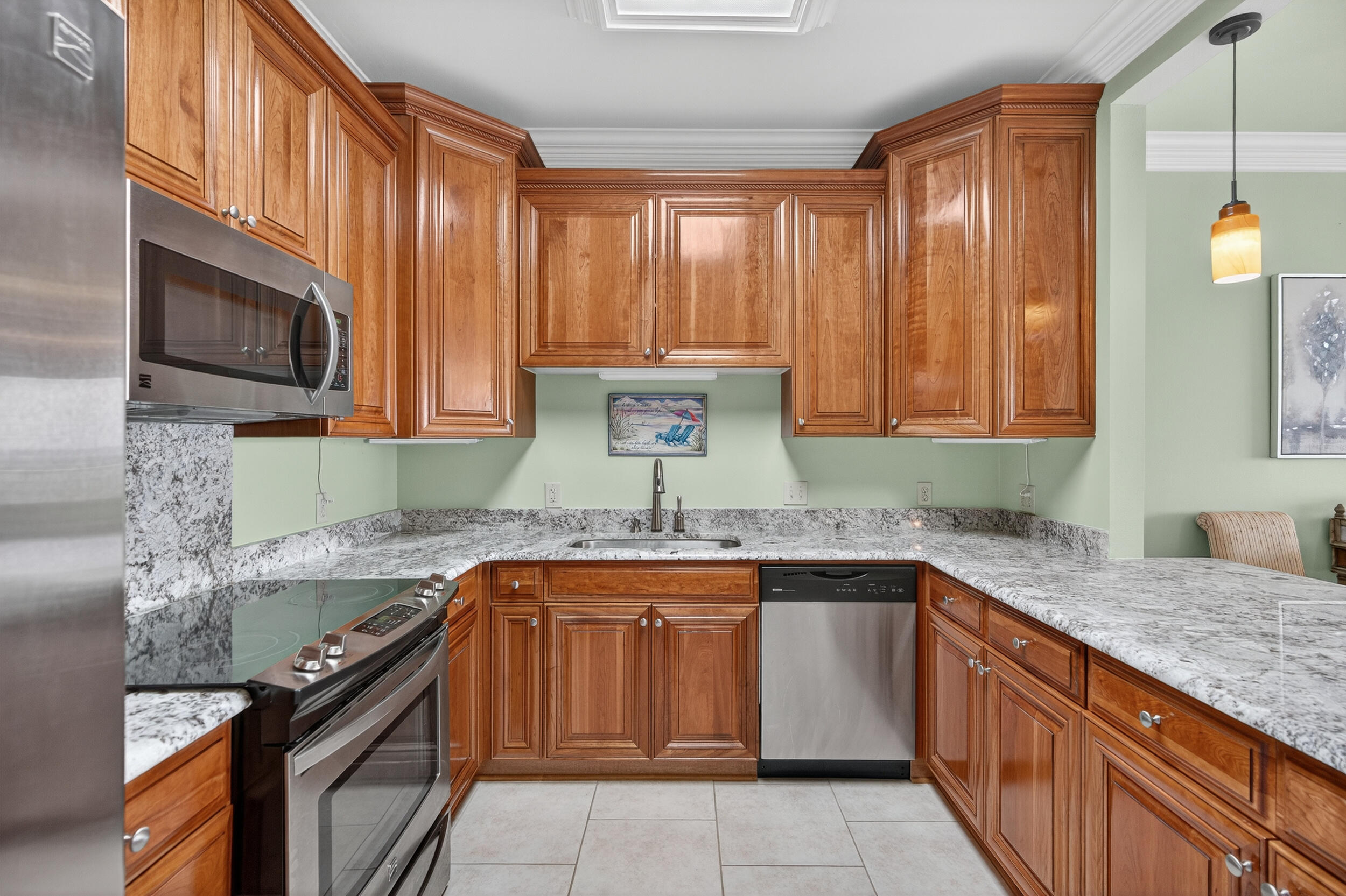 30 Moreno Point Road, Unit 702A Destin, FL 32541 - Photo 2 of 51 a kitchen with a sink stove top oven and cabinets
