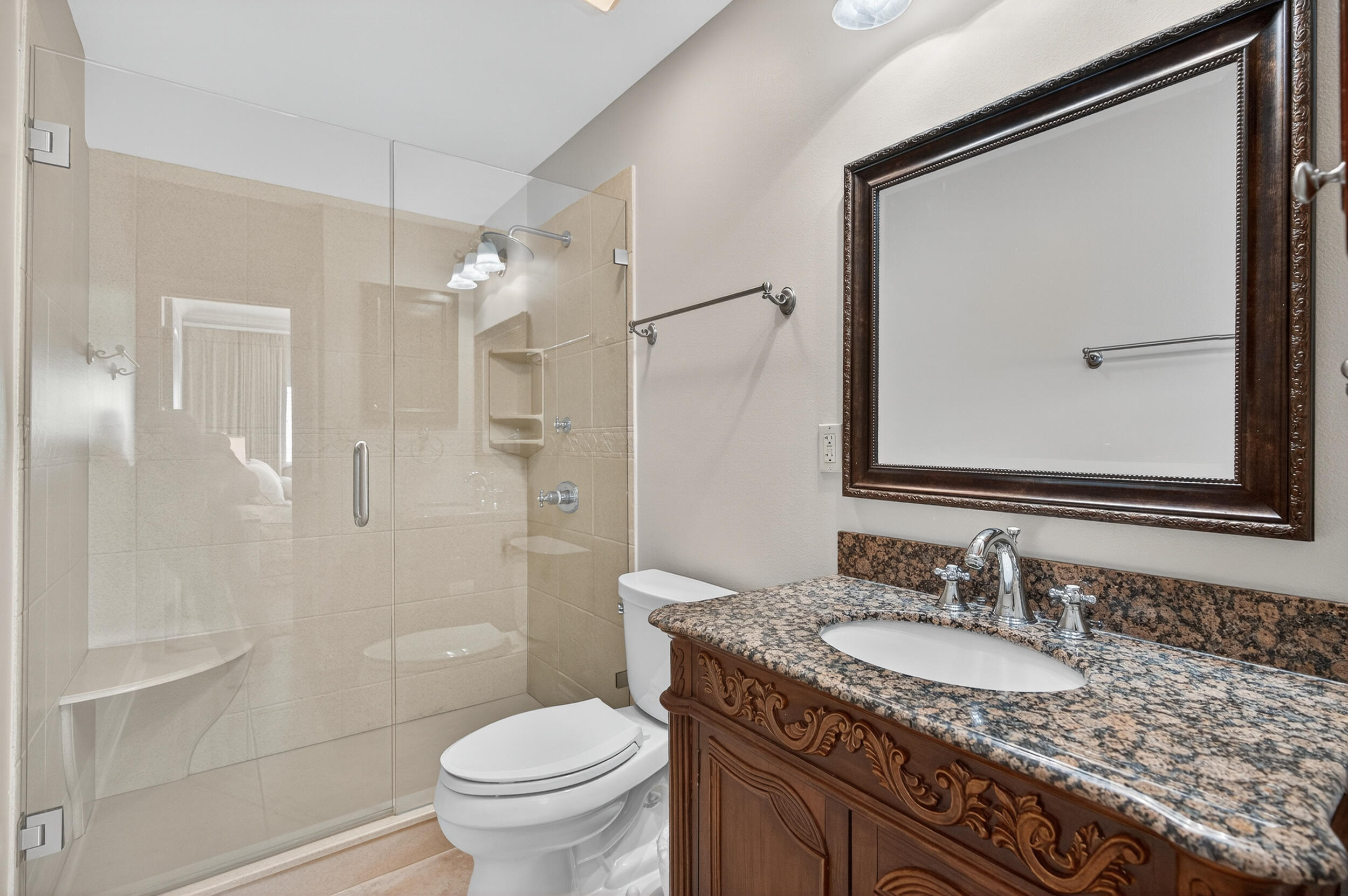 30 Moreno Point Road, Unit 702A Destin, FL 32541 - Photo 31 of 51 a bathroom with a granite countertop sink toilet and shower