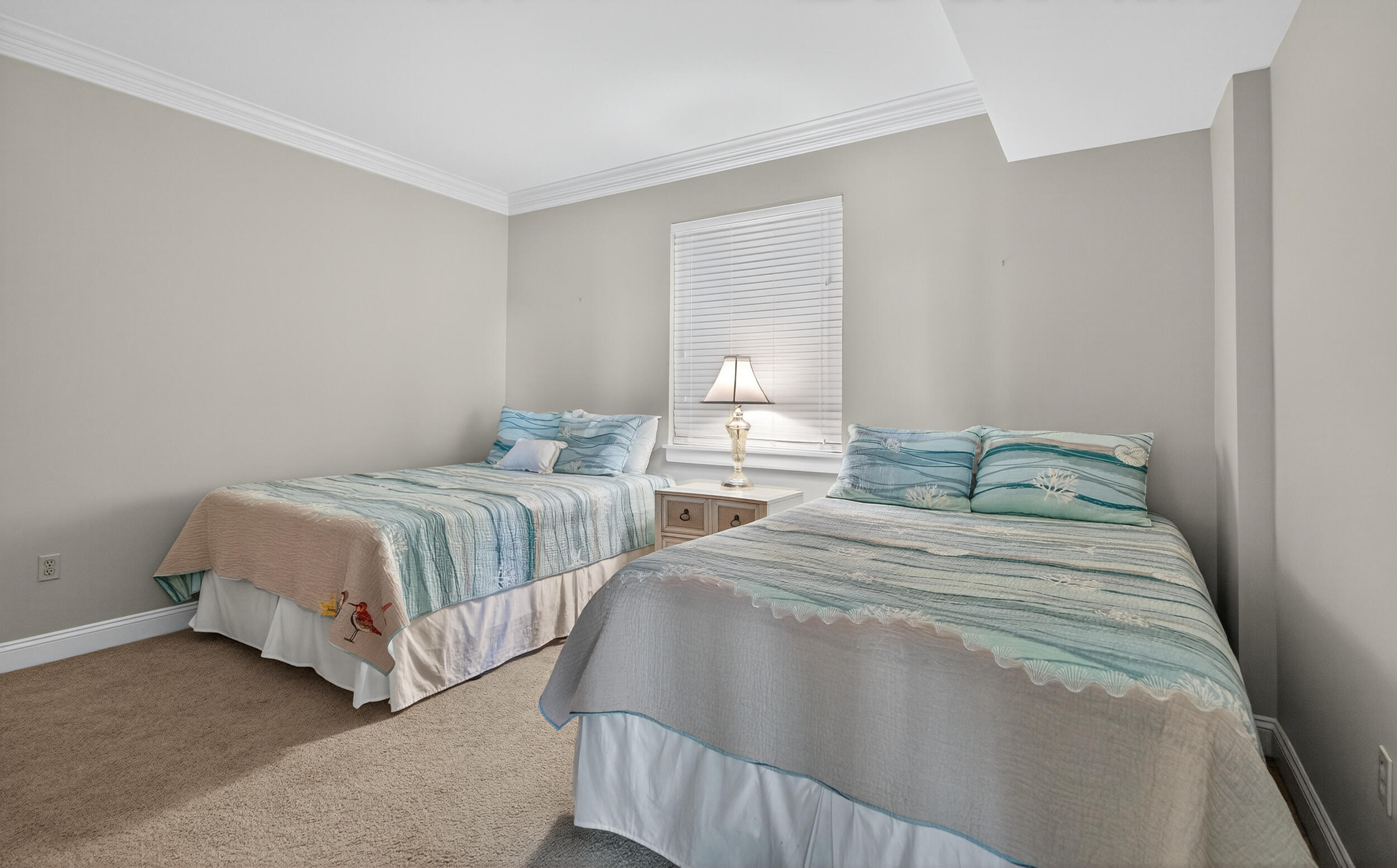 30 Moreno Point Road, Unit 702A Destin, FL 32541 - Photo 32 of 51 a bedroom with two beds and white walls