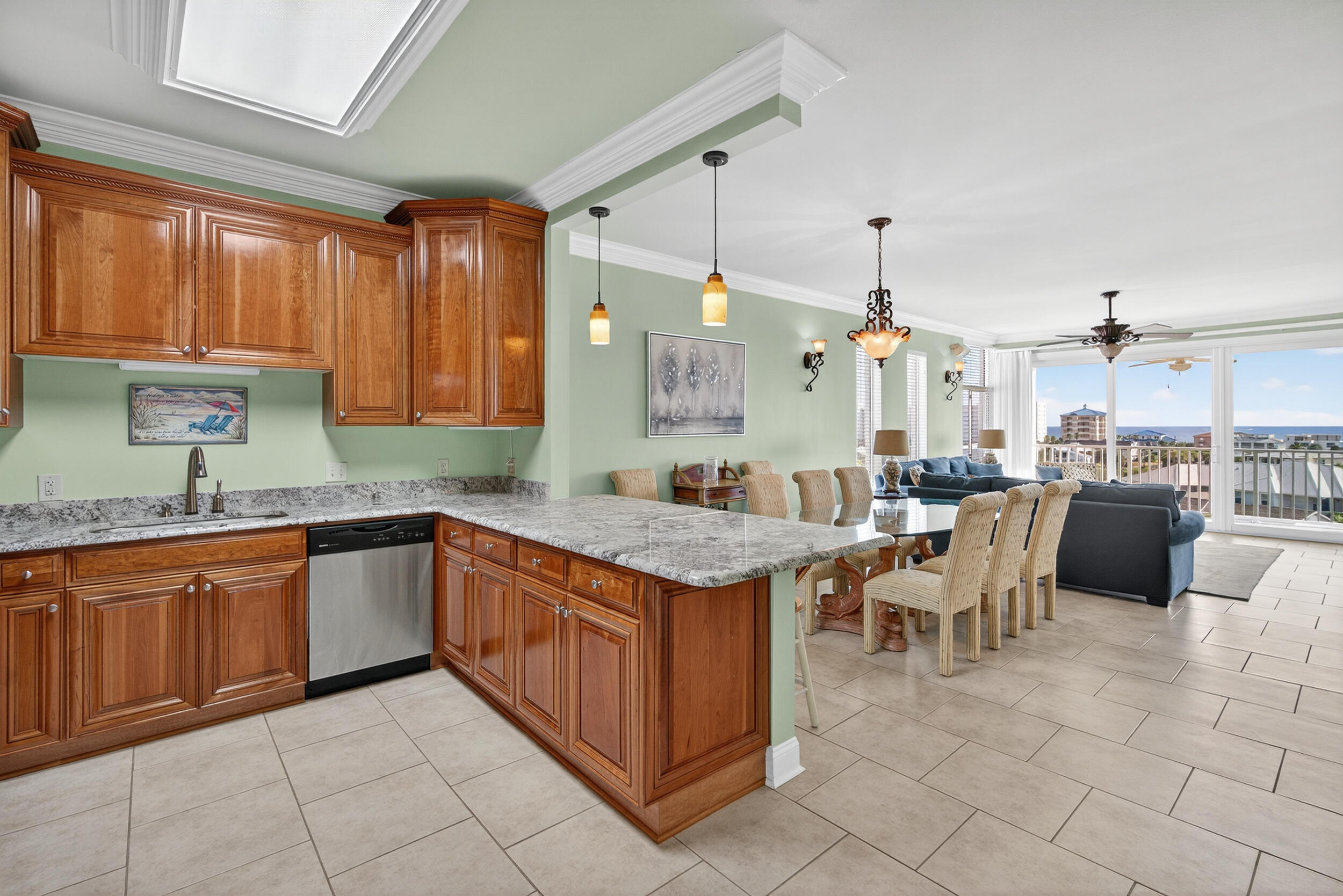 30 Moreno Point Road, Unit 702A Destin, FL 32541 - Photo 7 of 51 a kitchen with granite countertop a sink and a stove