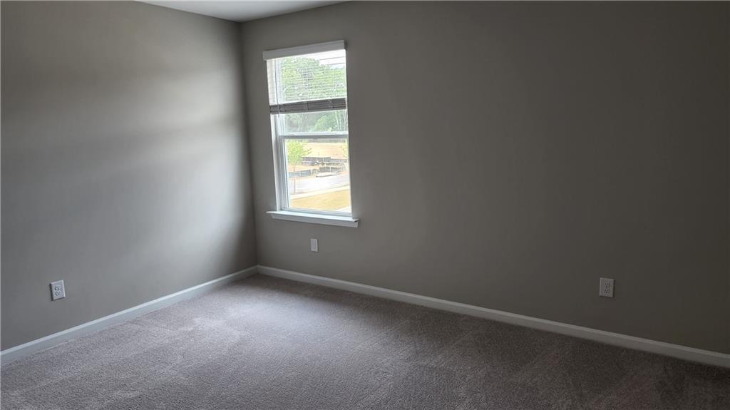 400 Grey Falcon Avenue Braselton, GA 30517 - Photo 29 of 31 an empty room with a window