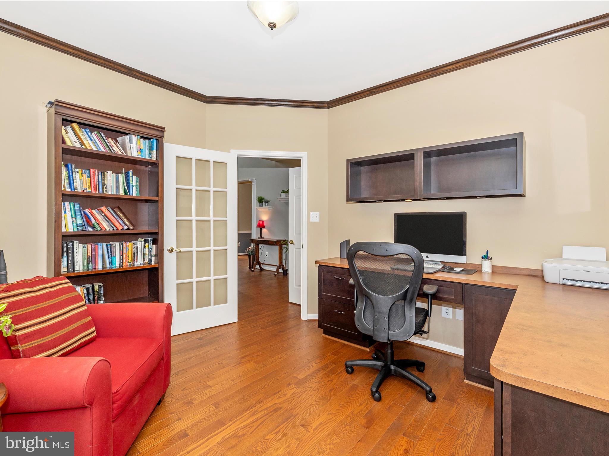 6470 Saddlebrook Lane Frederick, MD 21701 - Photo 12 of 74 a view of a workspace with furniture and a bookshelf