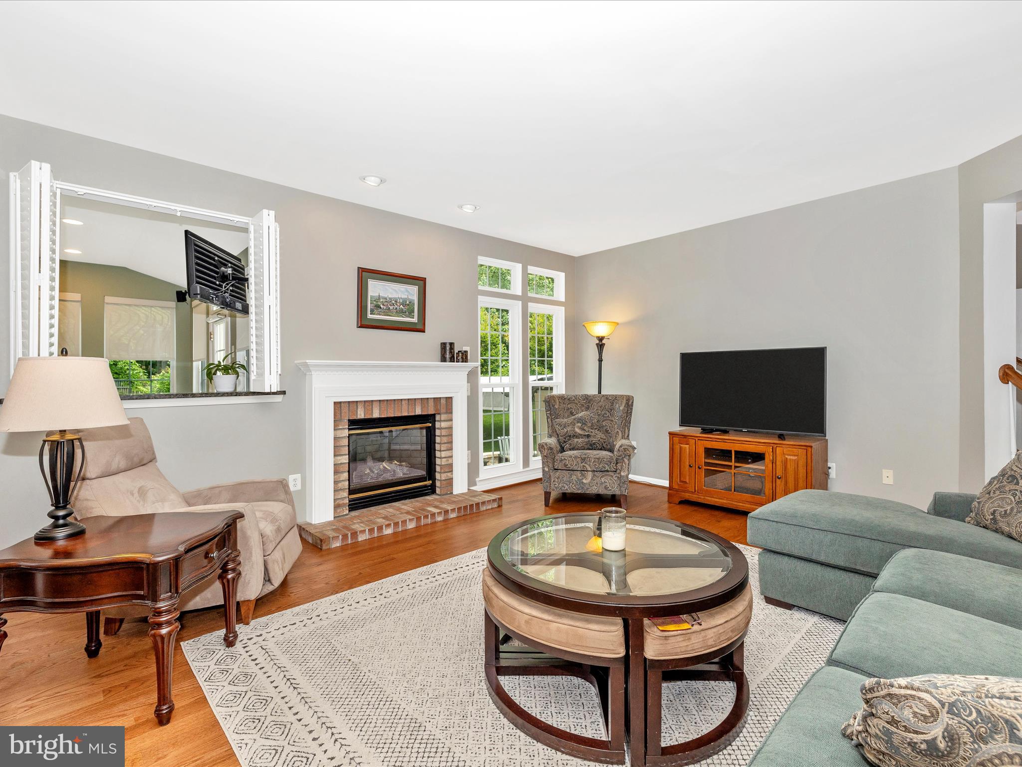 6470 Saddlebrook Lane Frederick, MD 21701 - Photo 14 of 74 a living room with furniture a rug and a fireplace