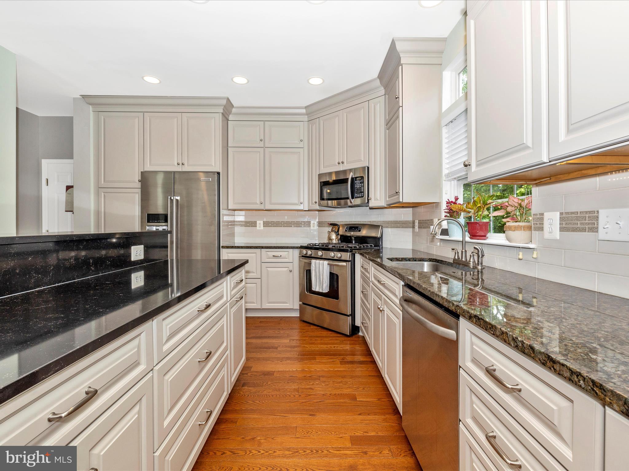 6470 Saddlebrook Lane Frederick, MD 21701 - Photo 19 of 74 outdoor kitchen with stainless steel appliances granite countertop a stove top oven a sink dishwasher and a refrigerator