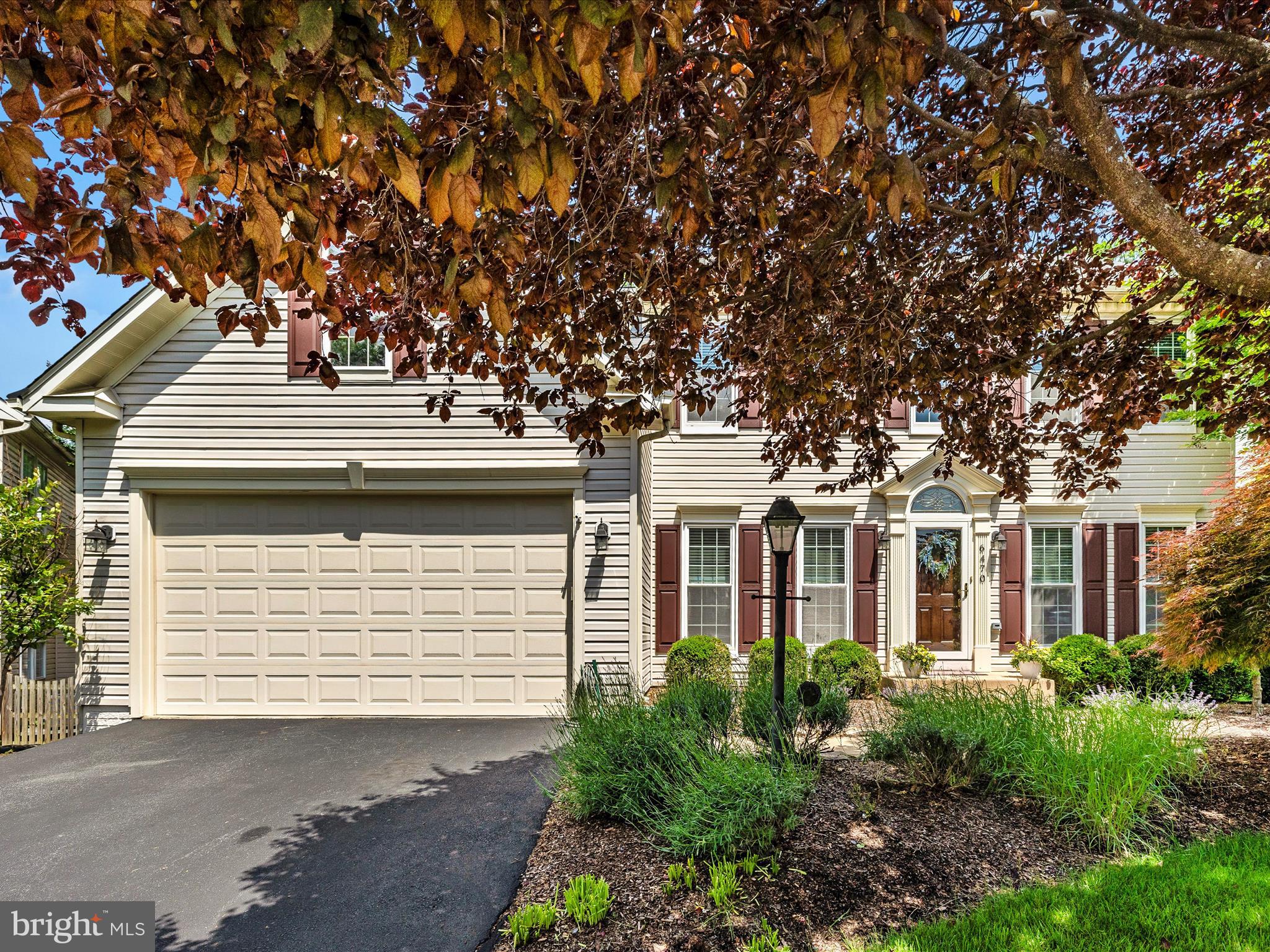 6470 Saddlebrook Lane Frederick, MD 21701 - Photo 2 of 74 a front view of a house with a garden