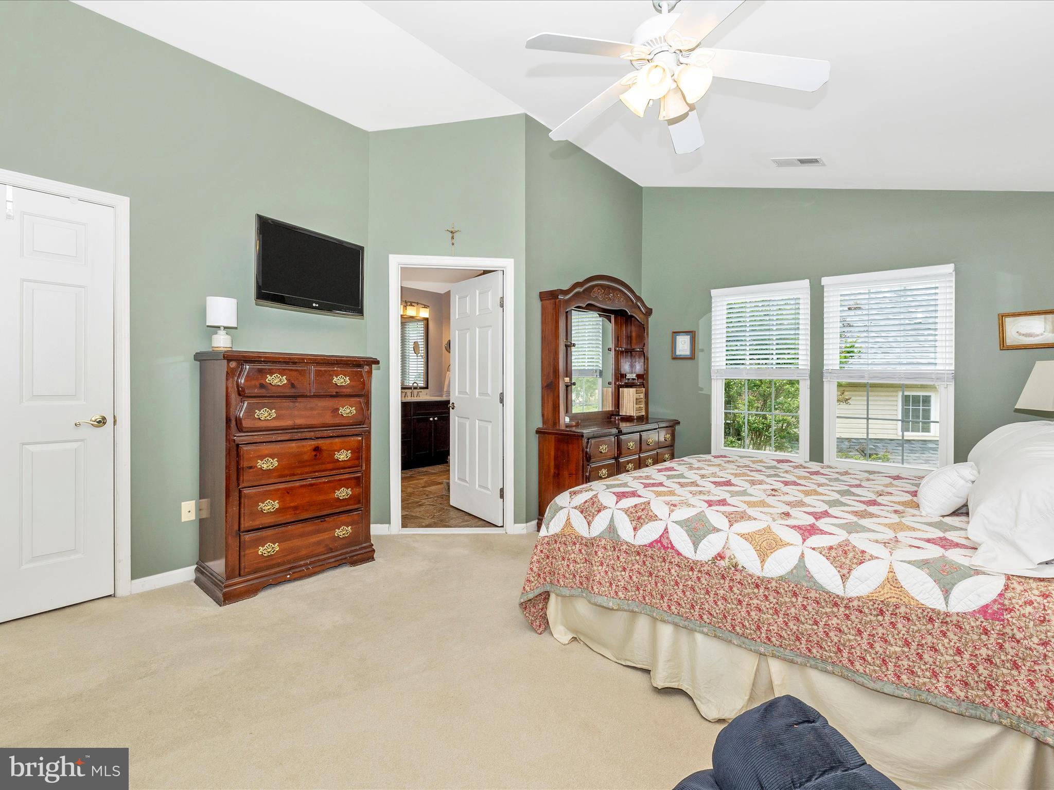 6470 Saddlebrook Lane Frederick, MD 21701 - Photo 27 of 74 a bedroom with a bed and a flat screen tv