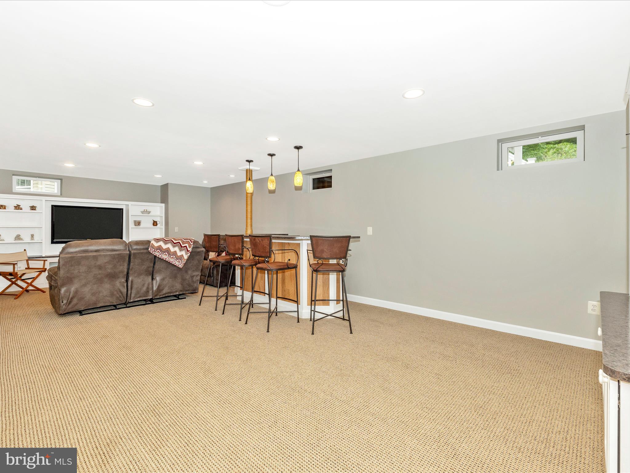6470 Saddlebrook Lane Frederick, MD 21701 - Photo 36 of 74 a living room with furniture and a flat screen tv