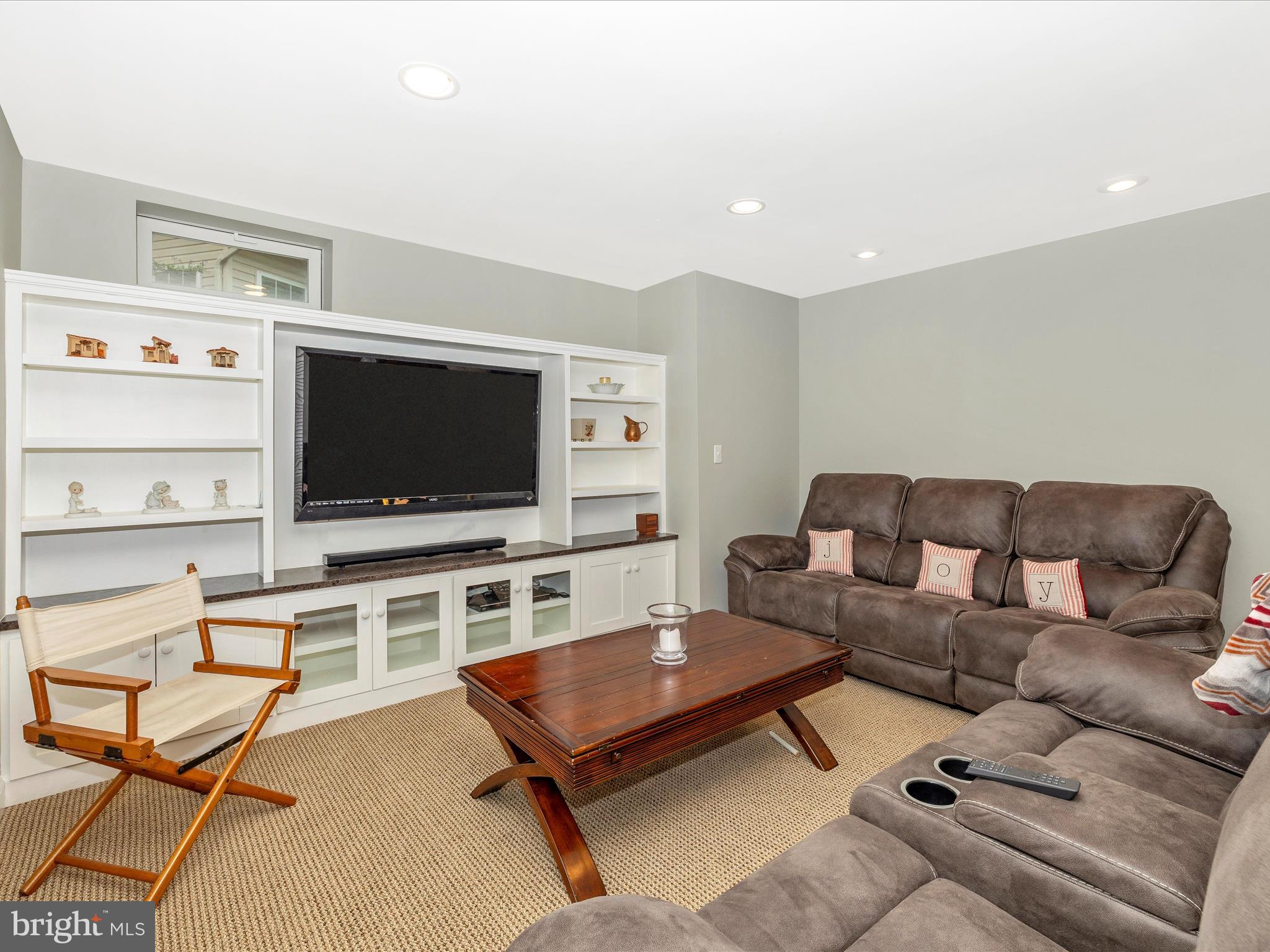 6470 Saddlebrook Lane Frederick, MD 21701 - Photo 39 of 74 a living room with furniture and a flat screen tv