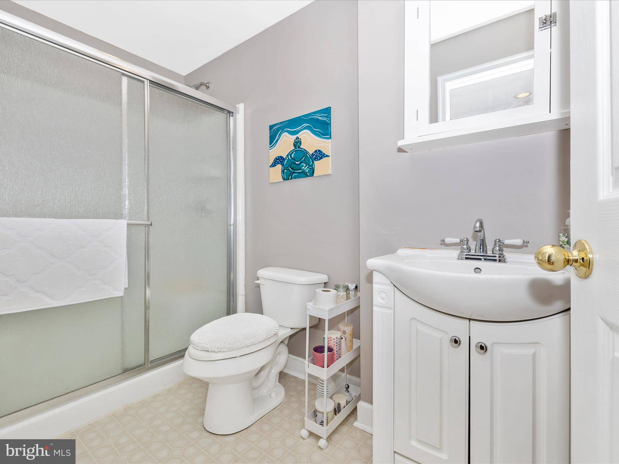 6470 Saddlebrook Lane Frederick, MD 21701 - Photo 44 of 74 a bathroom with a sink toilet and a mirror