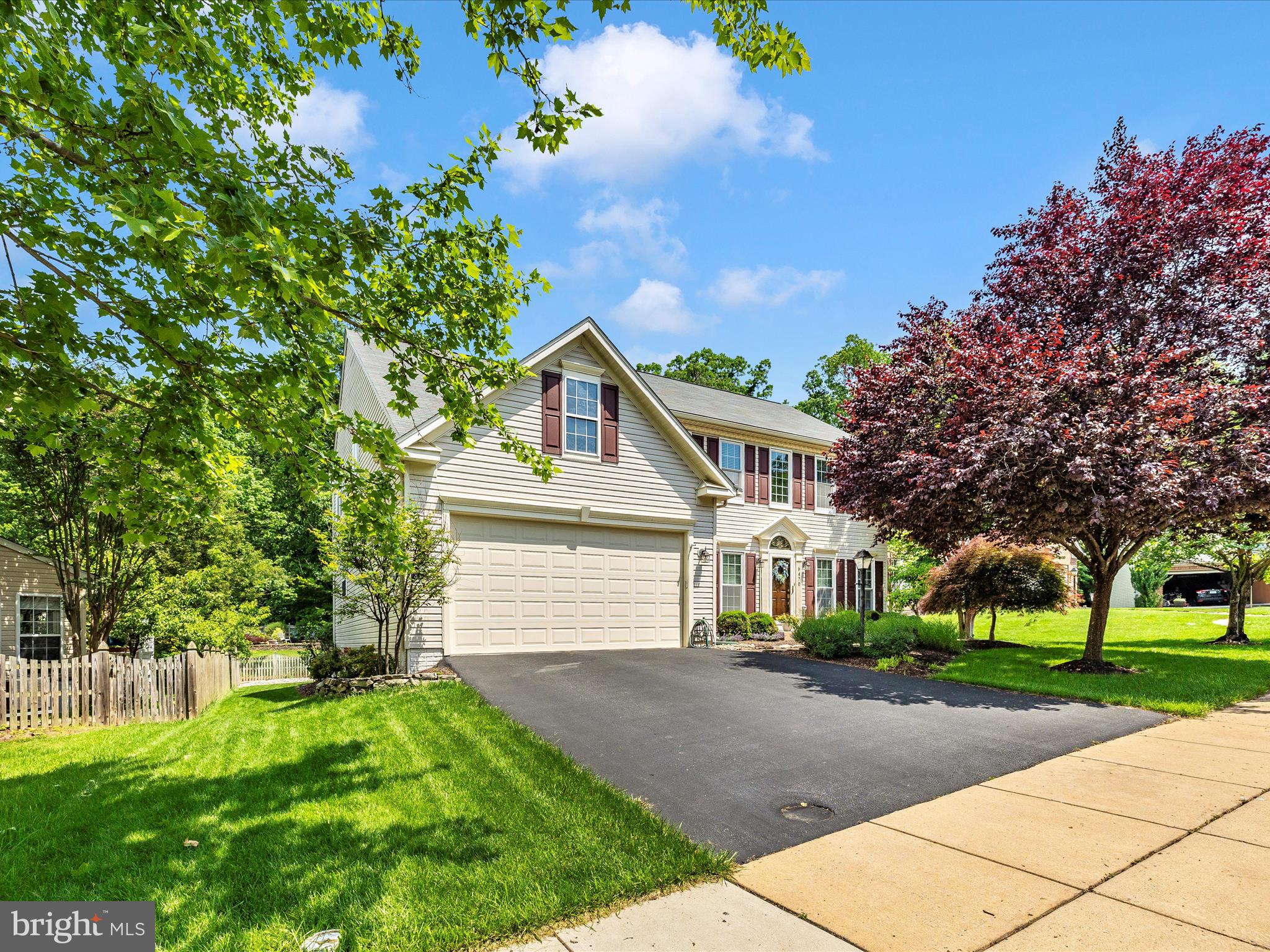 6470 Saddlebrook Lane Frederick, MD 21701 - Photo 45 of 74 a front view of a house with a garden
