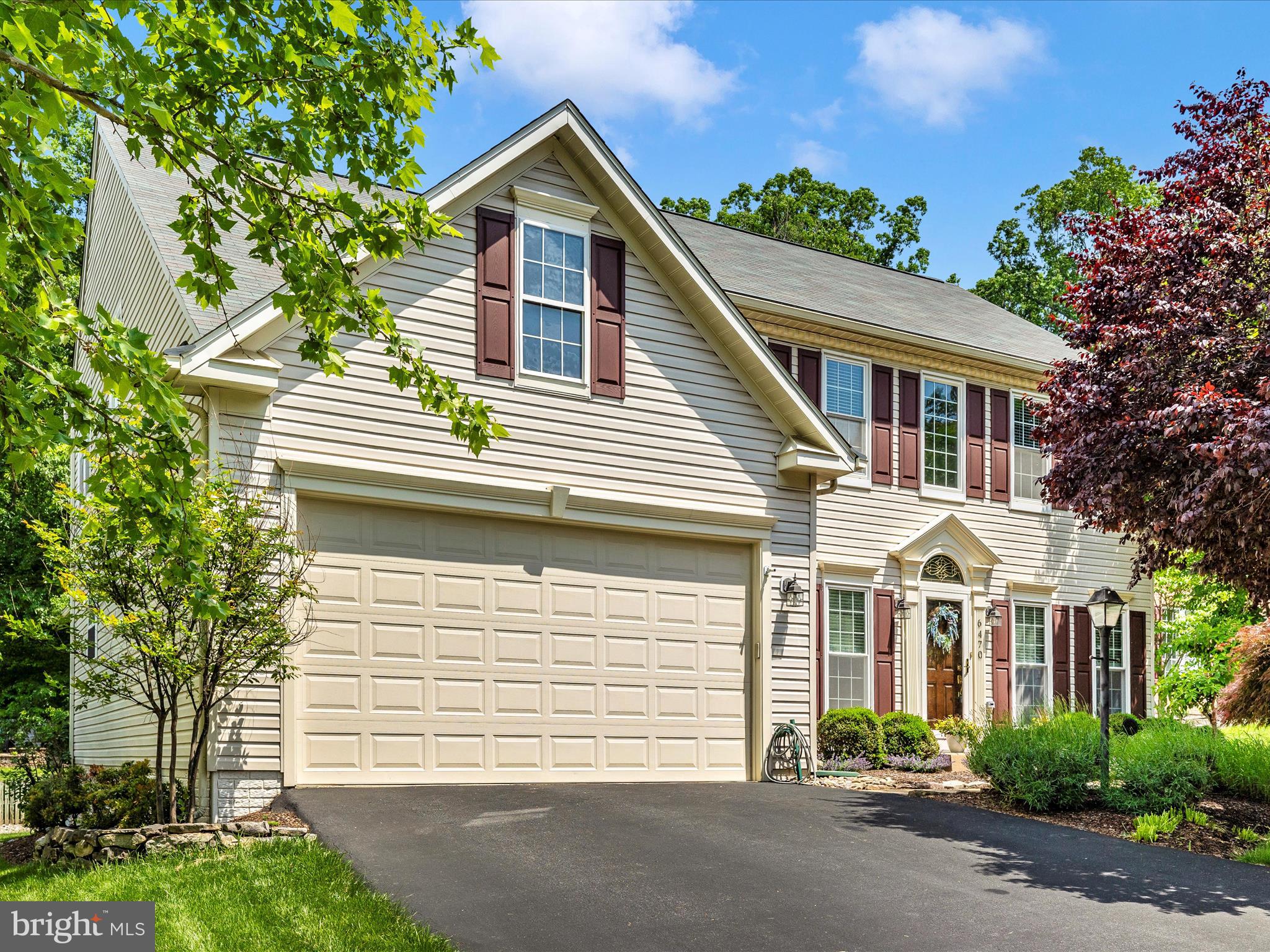 6470 Saddlebrook Lane Frederick, MD 21701 - Photo 46 of 74 a front view of a house with a yard