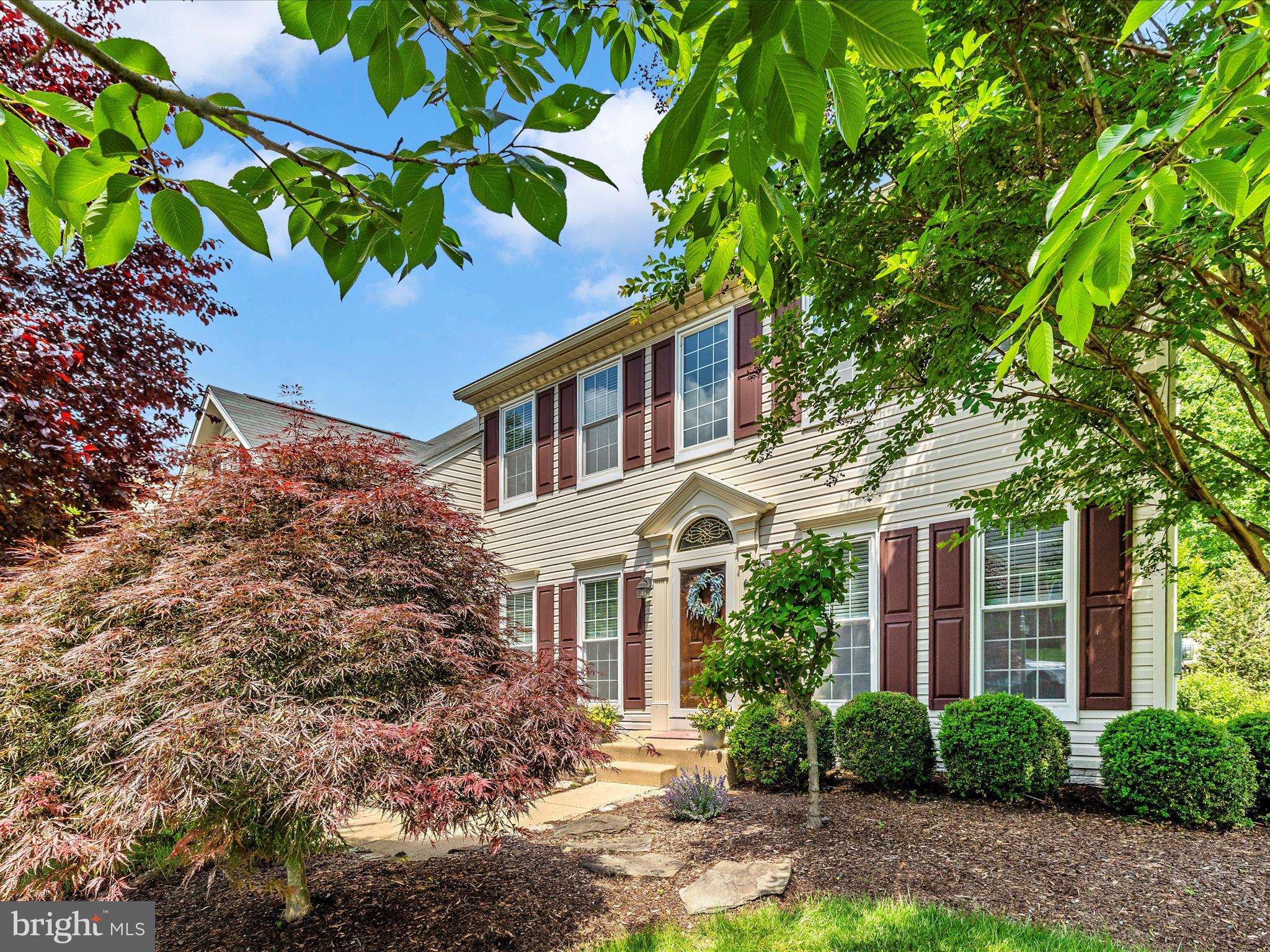6470 Saddlebrook Lane Frederick, MD 21701 - Photo 48 of 74 a house with a tree in front of it