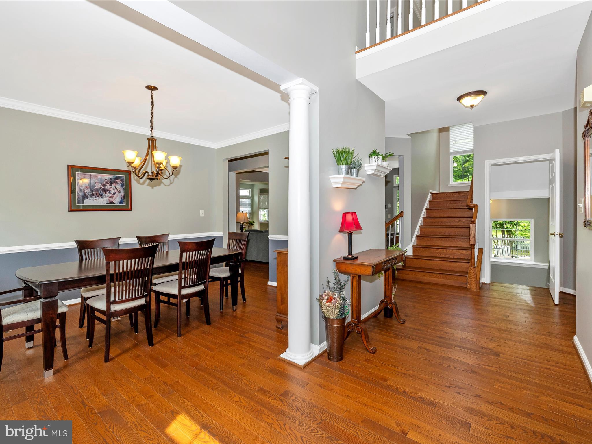 6470 Saddlebrook Lane Frederick, MD 21701 - Photo 6 of 74 a view of a dining room with furniture and wooden floor