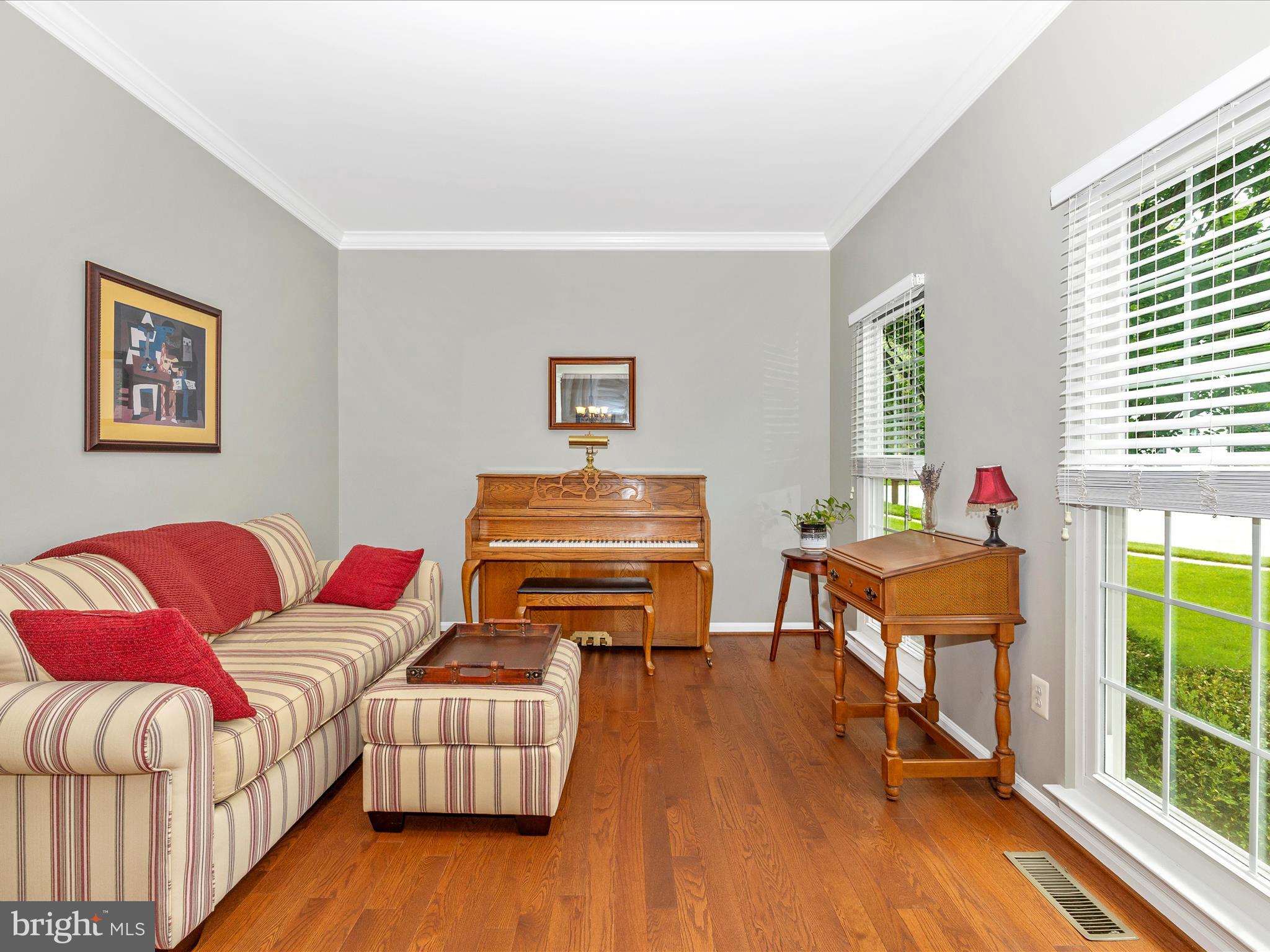 6470 Saddlebrook Lane Frederick, MD 21701 - Photo 7 of 74 a living room with furniture and a wooden floor