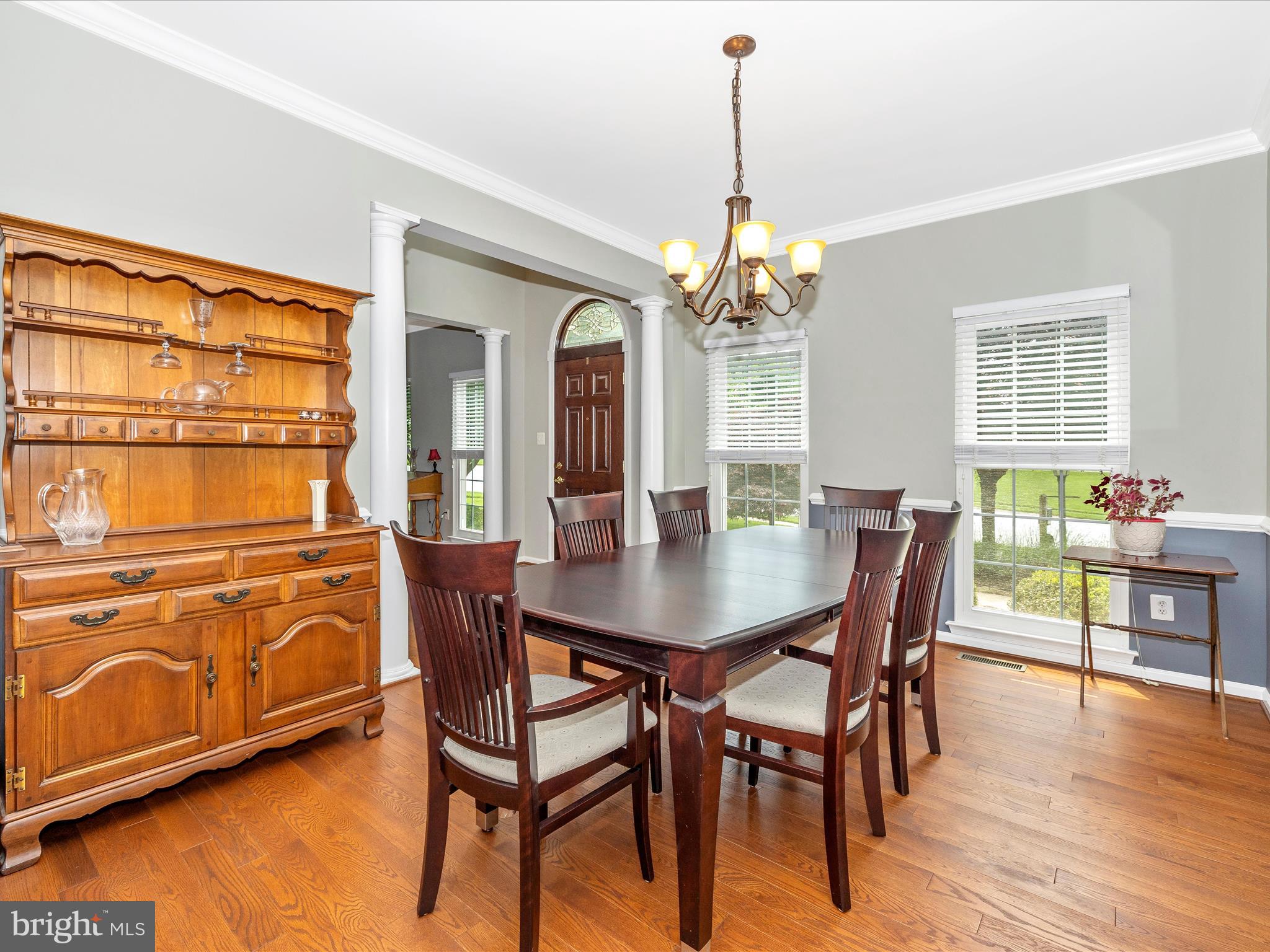 6470 Saddlebrook Lane Frederick, MD 21701 - Photo 9 of 74 a view of a dining room with furniture window and wooden floor
