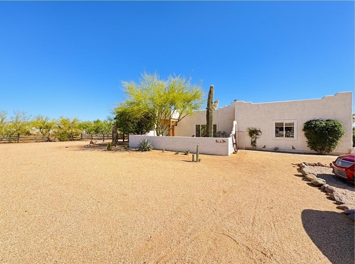 1033 East Irvine Road, Unit A Phoenix, AZ 85086 - Photo 2 of 26 a view of a lake with a house in the background