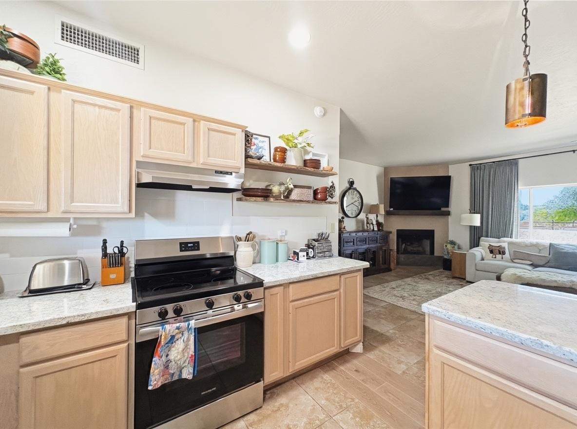 1033 East Irvine Road, Unit A Phoenix, AZ 85086 - Photo 8 of 26 a kitchen with stainless steel appliances granite countertop a stove and a sink