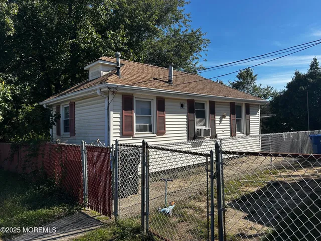 a kitchen with cabinets appliances and a window