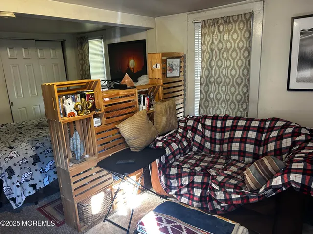 a bedroom with a bed and a lamp