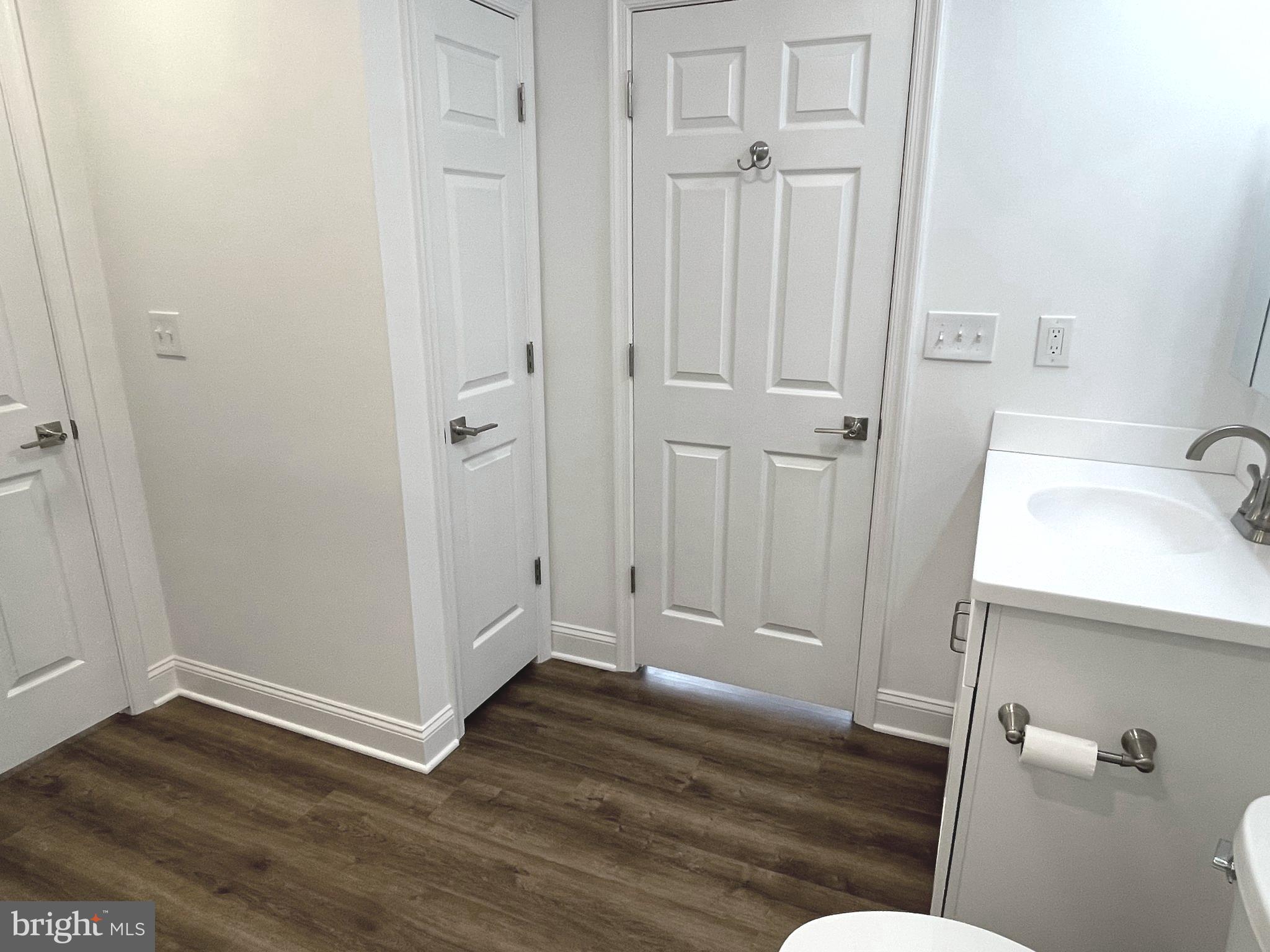 26 South State Street, Unit 2A Newtown, PA 18940 - Photo 15 of 18 Bathroom linen closet and bedroom entry