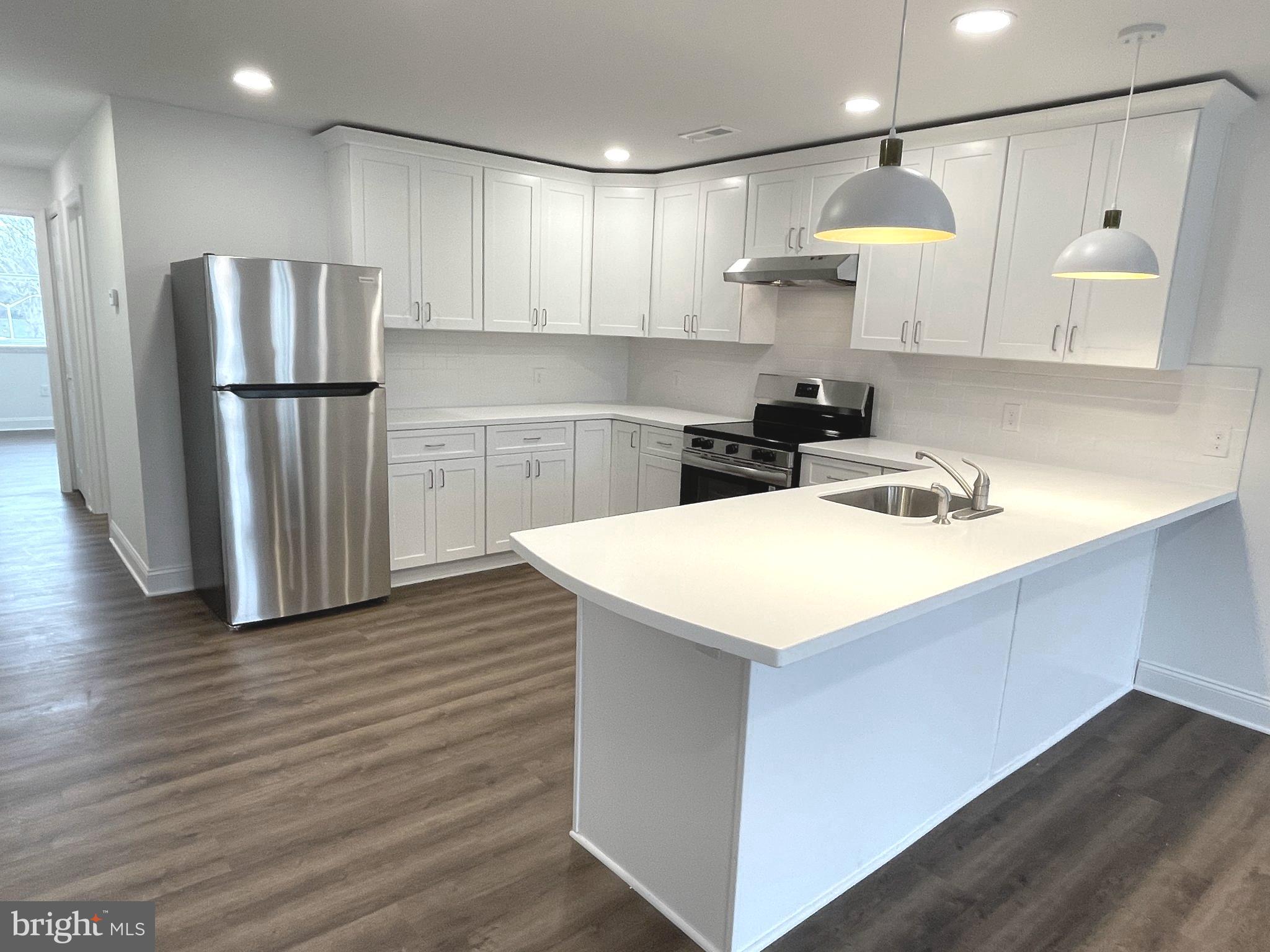 26 South State Street, Unit 2A Newtown, PA 18940 - Photo 2 of 18 Kitchen with Breakfast Bar