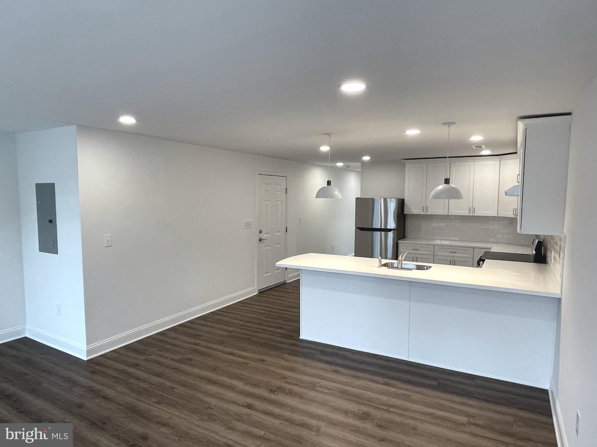 26 South State Street, Unit 2A Newtown, PA 18940 - Photo 6 of 18 Kitchen with Breakfast Bar