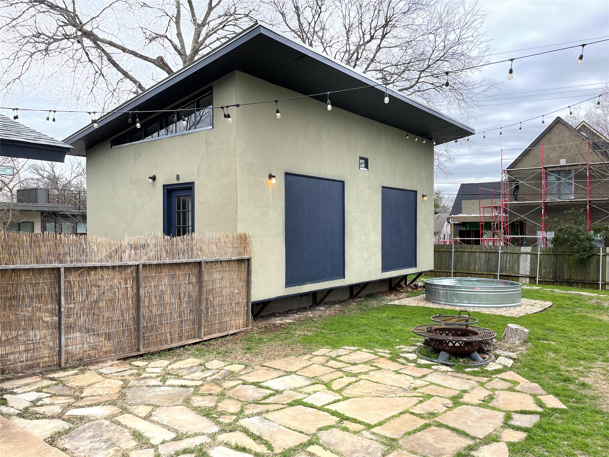 4619 Jinx Avenue, Unit A Austin, TX 78745 - Photo 17 of 21 Modern detached structure with stucco exterior and dark trim