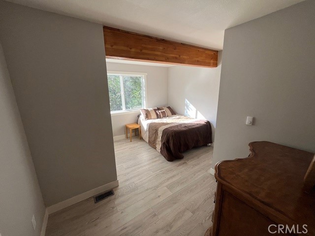 601 Sunderland Court Lake Arrowhead, CA 92352 - Photo 14 of 18 a bedroom with a bed and a window