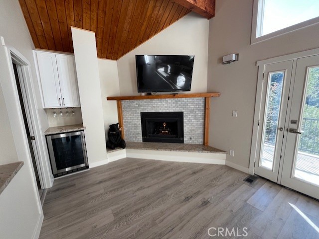 601 Sunderland Court Lake Arrowhead, CA 92352 - Photo 8 of 18 a living room with a fireplace and a flat screen tv