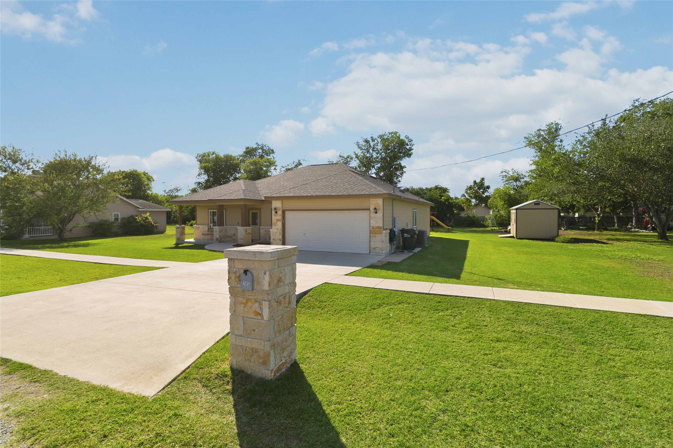 285 Hummingbird Way Martindale, TX 78655 - Photo 36 of 40 a front view of a house with a yard table and chairs
