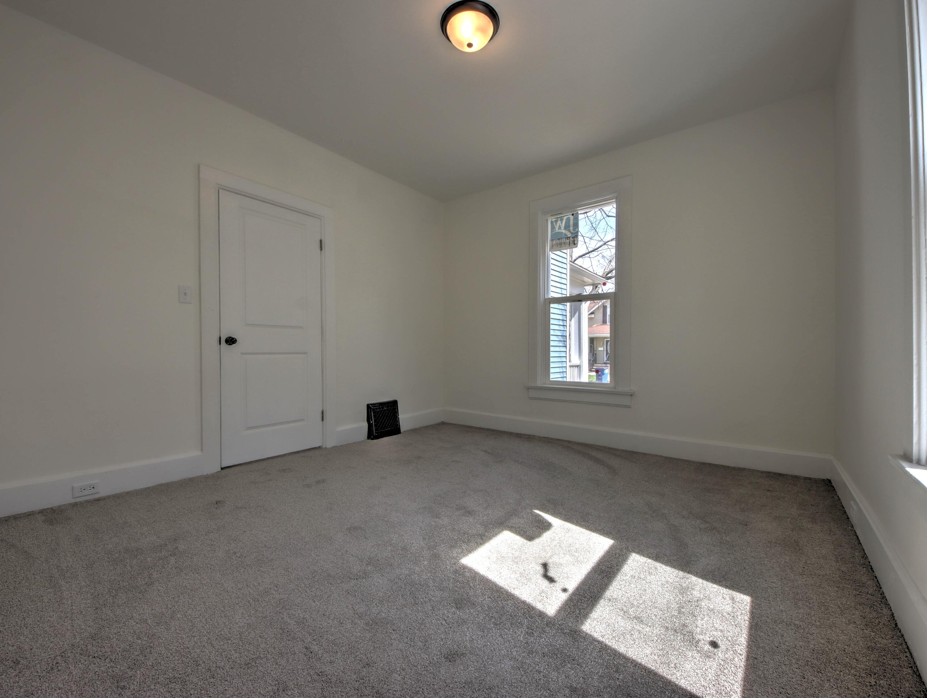 508 F Street La Porte, IN 46350 - Photo 23 of 52 an empty room with windows