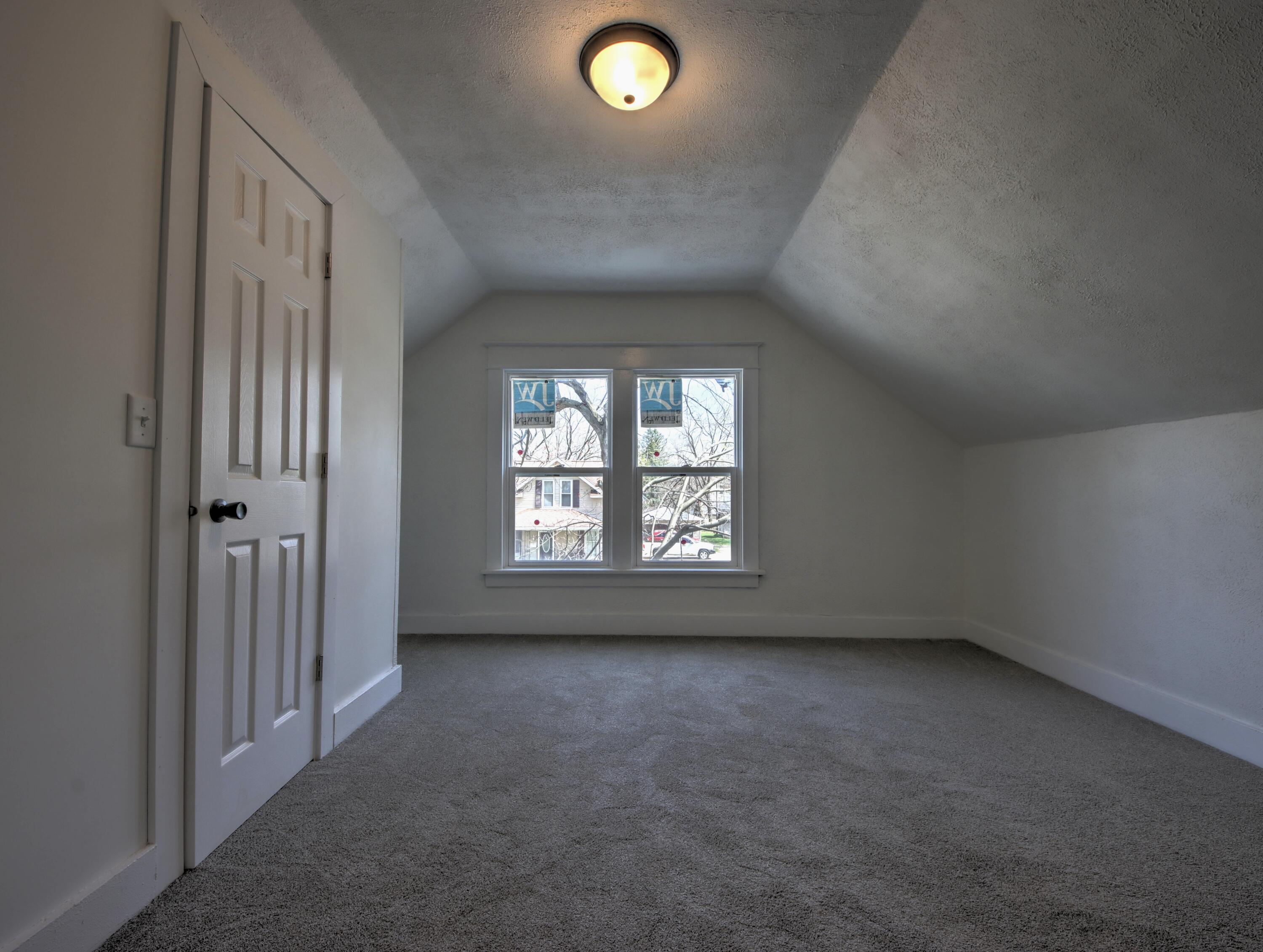 508 F Street La Porte, IN 46350 - Photo 31 of 52 an empty room with a empty space and windows