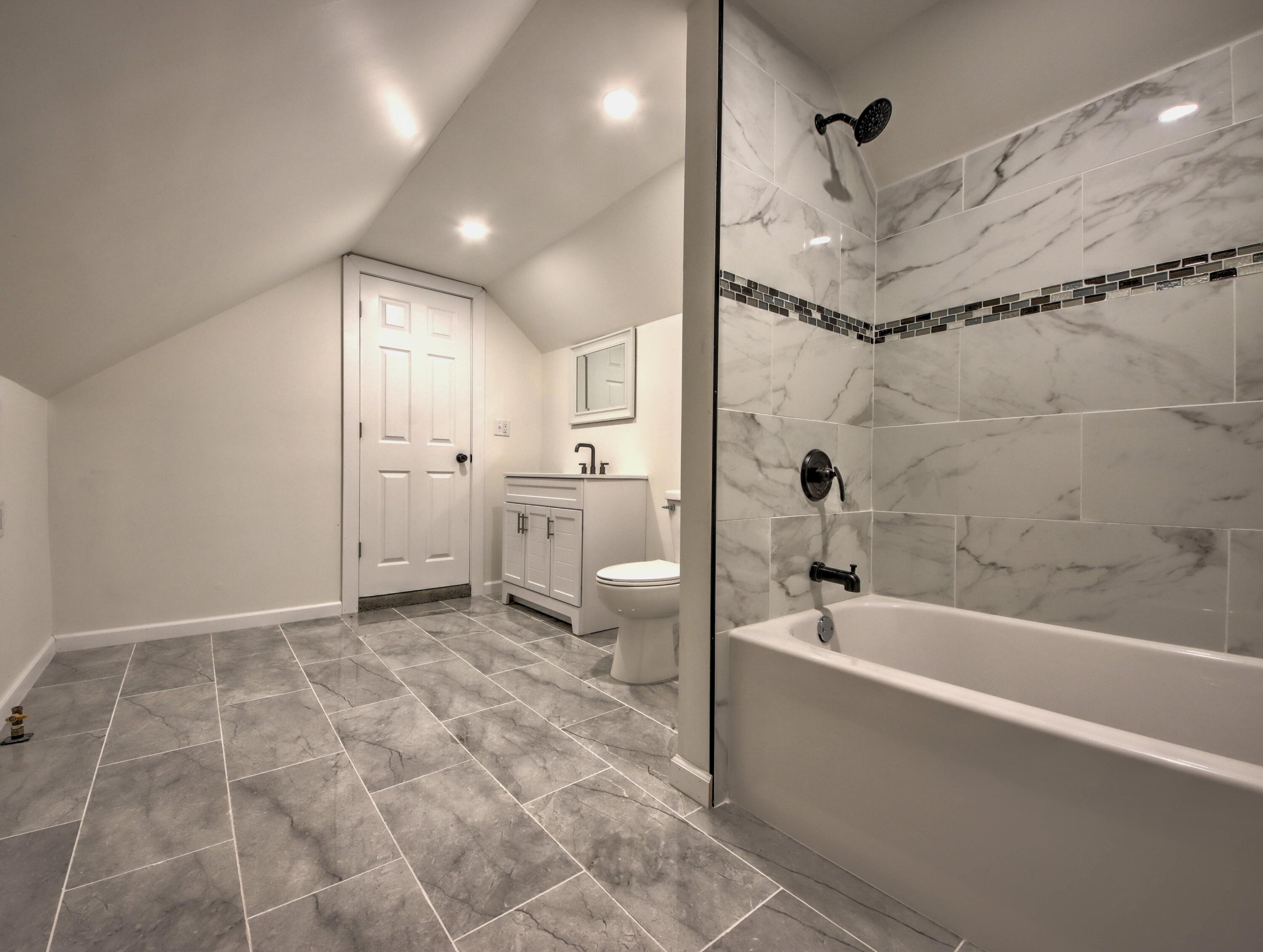 508 F Street La Porte, IN 46350 - Photo 35 of 52 a bathroom with a bathtub and a shower