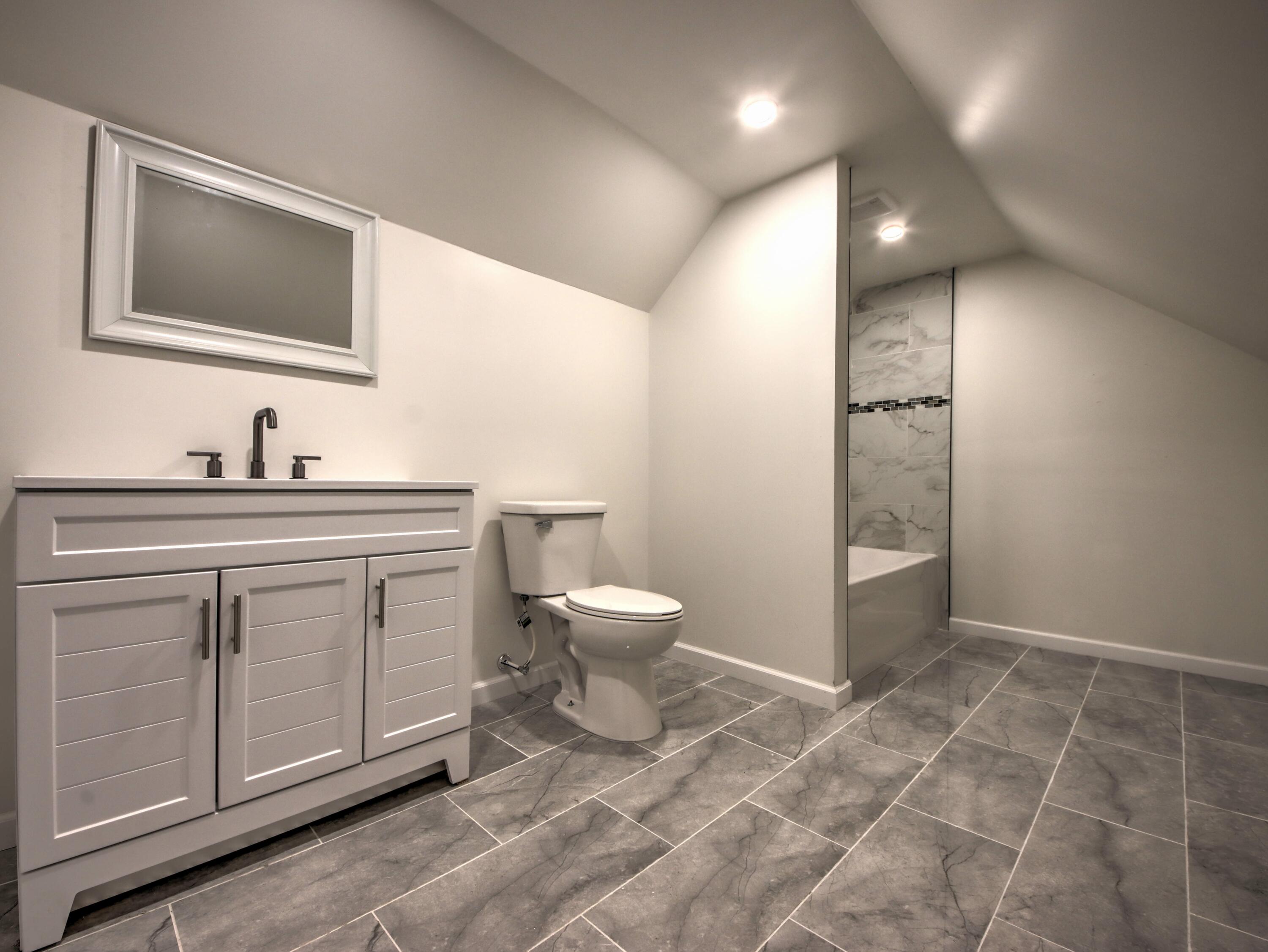 508 F Street La Porte, IN 46350 - Photo 36 of 52 a bathroom with a toilet sink and mirror
