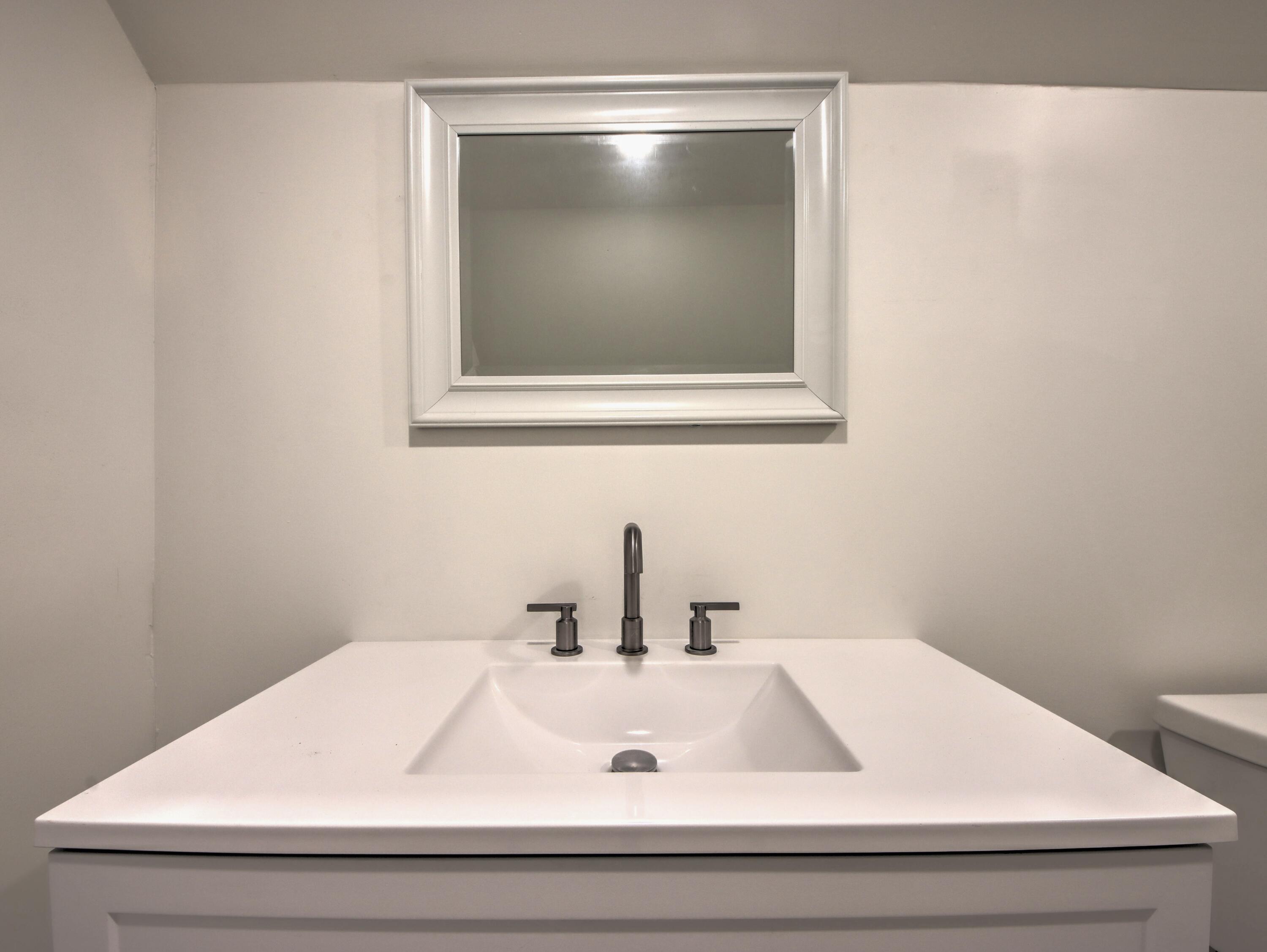 508 F Street La Porte, IN 46350 - Photo 38 of 52 a bathroom with a sink and mirror