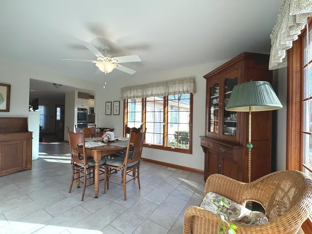 a dining room with furniture and window