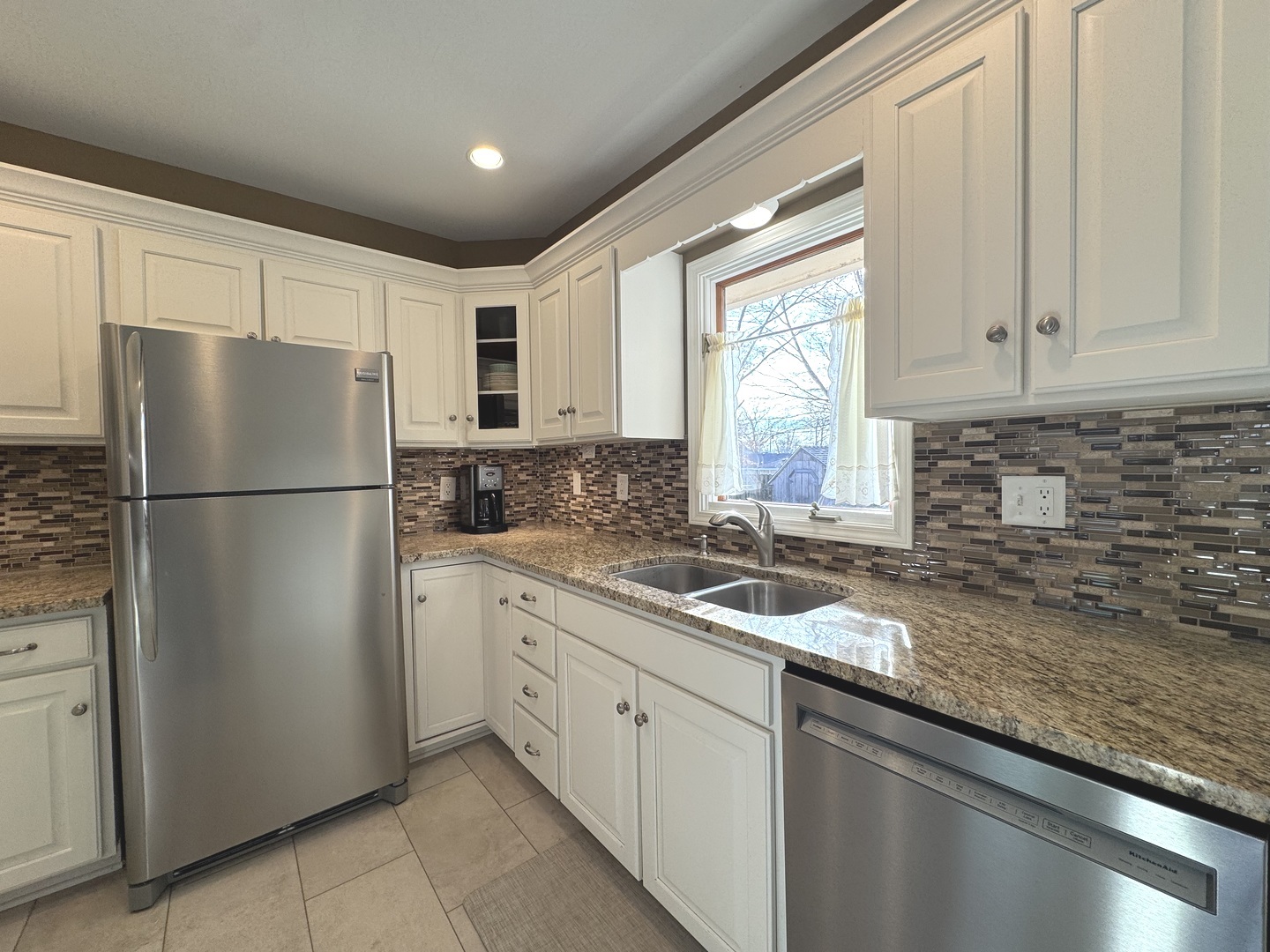 13 Erin Lane Kankakee, IL 60901 - Photo 8 of 34 a kitchen with stainless steel appliances granite countertop a refrigerator sink and cabinets