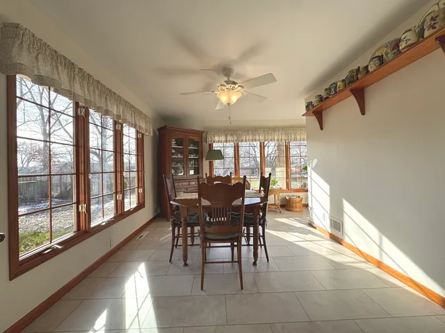a view of a dining room with furniture window and outside view