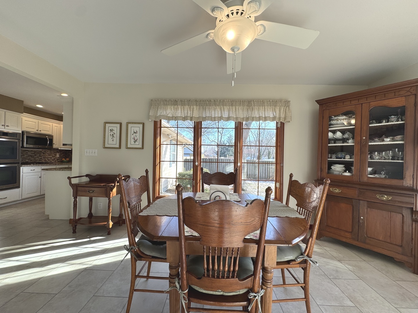 13 Erin Lane Kankakee, IL 60901 - Photo 10 of 34 a dining room with furniture a chandelier and window
