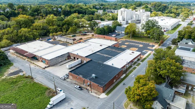 a view of a balcony with wooden floor and city view