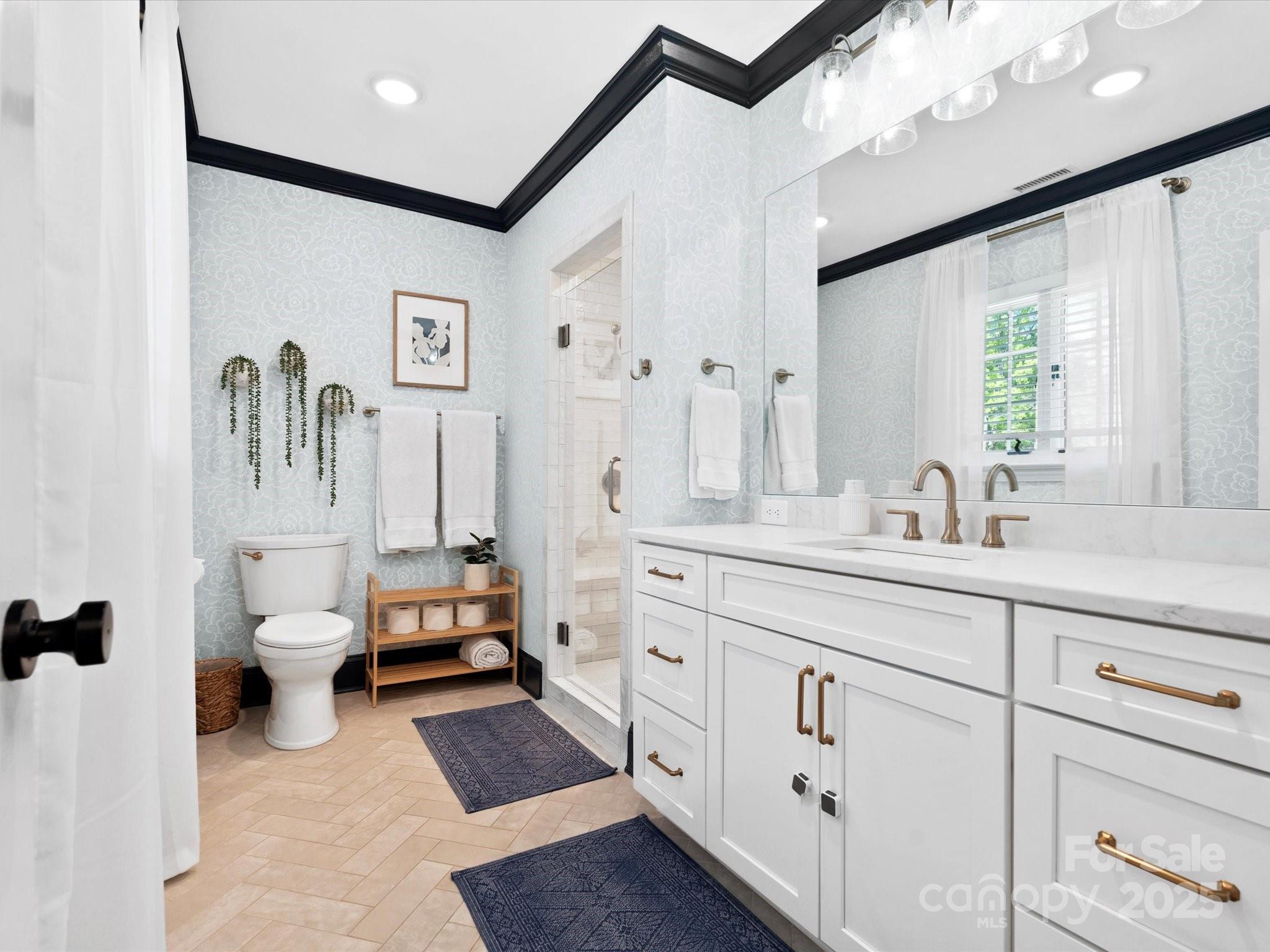 1927 South Wendover Road Charlotte, NC 28211 - Photo 16 of 36 a spacious bathroom with a double vanity sink a mirror and a shower